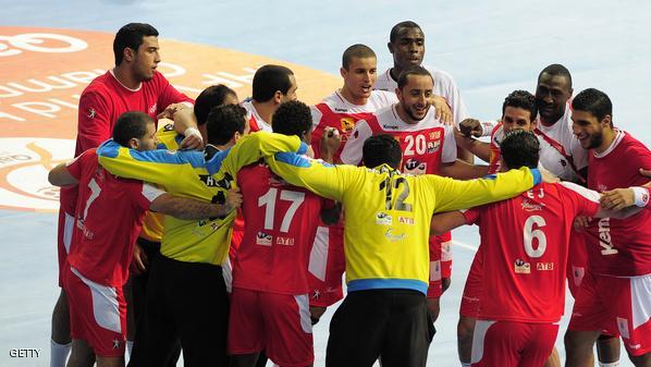 Tunisian's players celebrate after winning the 23rd Men's Handball World Championships preliminary round Group A match Argentina vs Tunisia at the Palau Sant Jordi in Barcelona on January 18, 2013. Tunisia won 22-18. AFP PHOTO/ JOSEP LAGO (Photo credit should read JOSEP LAGO/AFP/Getty Images)